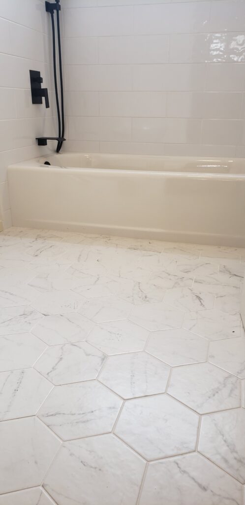 Bathroom Remodel, Contemporary Floor Tile and fixtures, Residential Remodel, Home Construction